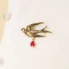 Urban Hippies Zwaluw Broche In Goud En Rood>Vrouwen Sieraden